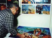 Artist Essam Azouz working on the painting